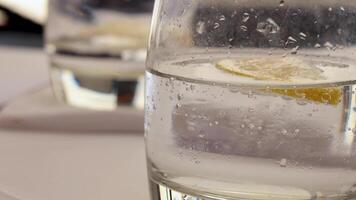 Close-up of a glass with lemon slice video