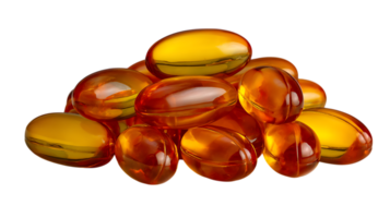 A pile of translucent amber colored gel capsules isolated on a transparent background isolated on transparent background png