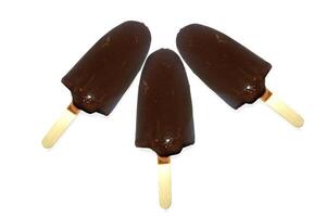 Three chocolate icecreams isolated on white background photo