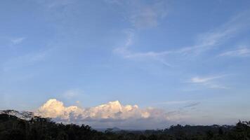 Picturesque Clouds over Lush Greenery A Serene Landscape View photo