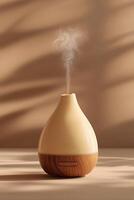 Modern Aroma Diffuser with Gentle Vapor on Beige Backdrop photo
