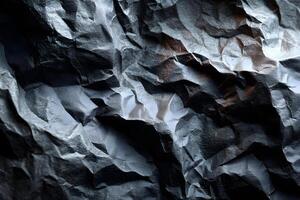 Crumpled Black Paper Texture with Deep Shadows photo