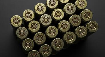 High detail close up of tightly linked weathered brass machine gun cartridges photo