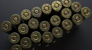 Close up top view of weathered brass machine gun cartridges and ammunition photo