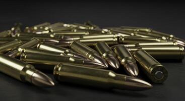Close up view of scattered 5.56mm rifle ammunition cartridges photo