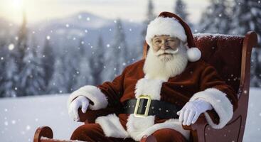 Santa claus winking while sitting in a red sleigh in a snowy winter landscape photo