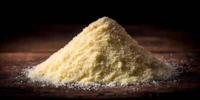 Pile of Grated Parmesan Cheese on Wooden Table Dark Background Food Photography photo