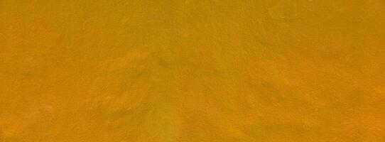 Gold texture background. Concrete wall texture paint, gold color surface blank for design. photo