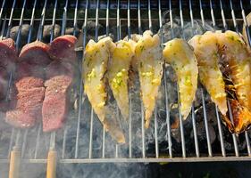 Surf and turf fillet steak and Lobster on a grill photo