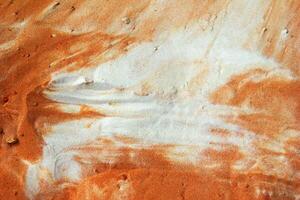 Abstract View of Textured Blend of Orange and White Sands Creating a Unique Pattern, Top View. photo