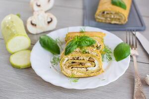 Summer vegetable zucchini roll with cheese. photo