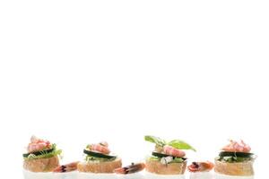 Gourmet appetizer with shrimps, greens and cucumbers for a buffet photo