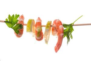 Still life of shrimps with lemon on white background photo
