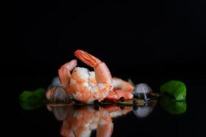Isolated studio composition of shrimp and spices on a background photo