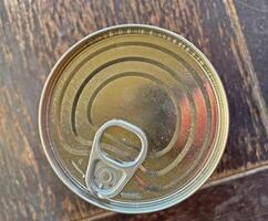 Tin can top view, tin lid with key photo