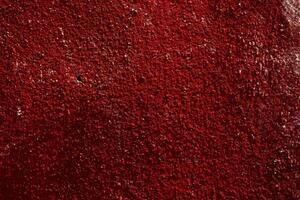 Rough red surface texture with detailed patterns and natural imperfections photo