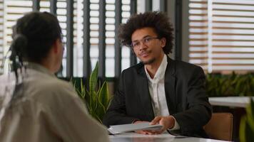 African American business leader businessman insurance agent bank reading resume intern sad client man dissatisfied refuse no failed job interview two businessmen office bad work report cooperation photo