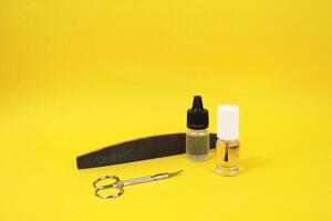 Manicure accessories on a yellow background. photo