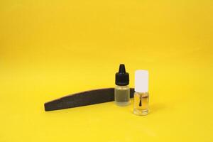 Nail file, cuticle oil and clear polish - easy manicure at home photo