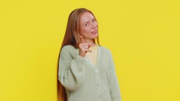 Call me, here is contact number. Caucasian middle-aged mature woman looking at camera doing phone gesture asking for conversation. Hotline online service proposition advertisement on yellow background video