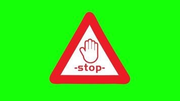 a stop sign with a hand on it on a green background video