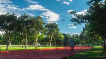 Time-lapse of people running on the athletics track in La Carolina Park during the morning in Quito - Ecuador video
