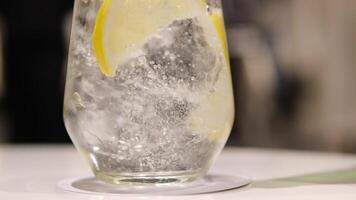 Lemon and lime punch served in glass bowl close up zoom shot slow motion selective focus video