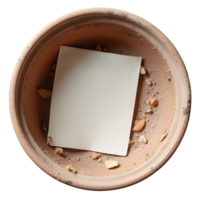 Aged terracotta pot holds blank paper, creating mysterious, solitary scene png