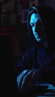 Modern hacker typing on laptop representing cyberattack, identity theft and computer virus threats video