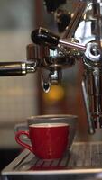 Fresh espresso flows from coffee machine video