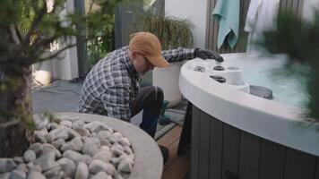 Maintenance of a Hot Tub in a Residential Backyard During the Day While Focusing on Equipment and Surroundings video