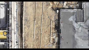 Construction Workers Engage in Groundwork at New Site Near City Center, Focusing on Foundations and Structural Preparation Throughout the Day video