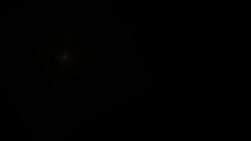 Animated Yellow Star Light Flares Bright Sparkle Effect Overlay on Black Background video