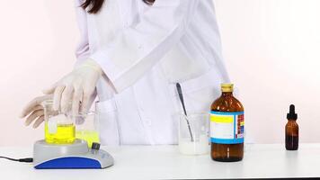 Scientist demonstrates iodine clock reaction experiment in laboratory setting video