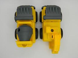 Photo of contruction vehicle toys mixer and exca. Can be used for t-shirt print, kids wear fashion design