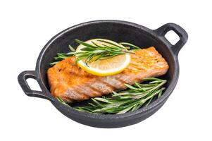 Fried salmon fillet with herbs, grilled fish steak in a pan isolated on white background. top view photo