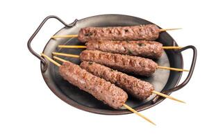 Grilled minced beef and lamb kebabs skewers with fresh spices, arabic kofta kofte kebab isolated on white background. top view photo