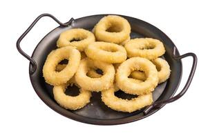 Ready for cooking Raw onion rings, uncooked vegetable isolated on white background. top view photo