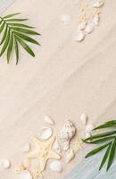 Tropical background featuring palm leaves, seashells, and starfish photo