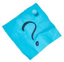 Crumpled sheet of blue paper with a black question mark drawn on it, attached with a blue pushpin, isolated background photo