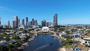 Aerial animation of a cityscape with canals, showcasing modern architecture and vibrant urban life under clear blue skies video