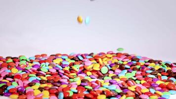 Hands interacting with colorful candies on table video