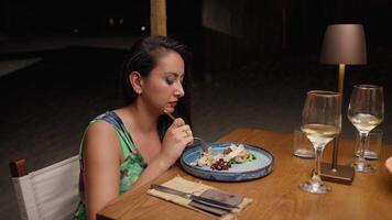 Woman Having A Relaxing Dinner At The Restaurant On The Beach During Summer At Night video
