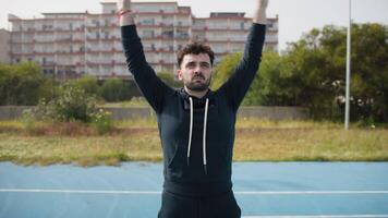 Man Does Breathing Exercises Before the Basketball Game in the Park video