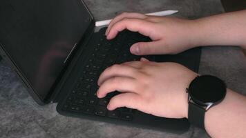 Close up of woman hands typing on digital tablet keyboard. video
