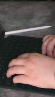 Woman hands typing on keyboard while working at home. video