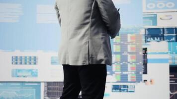 African american businessman contemplating about new powerful ideas to obtain funds, data insights for the financial and KPI projections decision making. Forecasting for productivity. Camera A. video