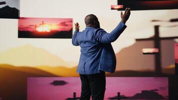 African american guy shows gratitude standing with hands in prayer sign, radiating inner peace and strength for spiritual devotion. Person showcasing peace of mind and contemplation. Camera A. video