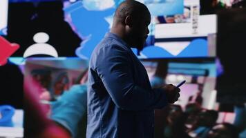 Young social media expert connecting on social network for trends on dashboard, showcasing user interface and digital web platforms. Power of technology, influence and internet presence. Camera B. video