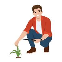 Gardener crouches beside a small plant, carefully inspecting its growth with a stick in hand. vector